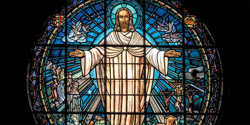 Stained glass window of risen Jesus