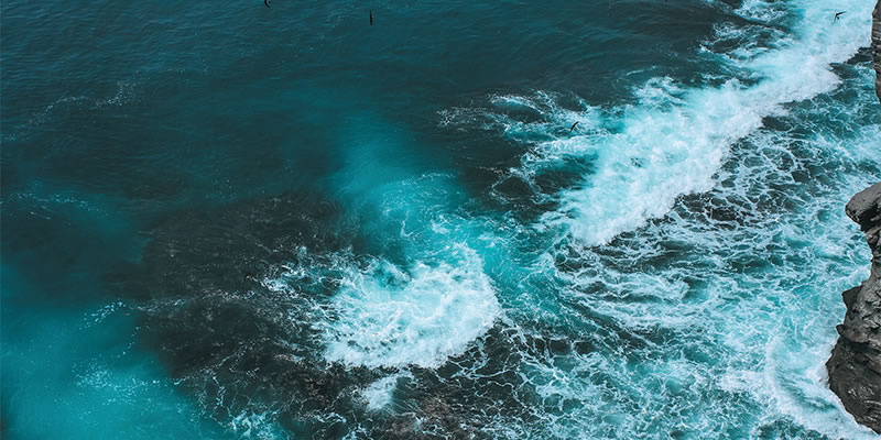 Ocean waves pound the shoreline