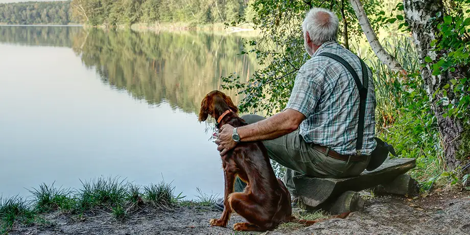 Man and dog by a lake