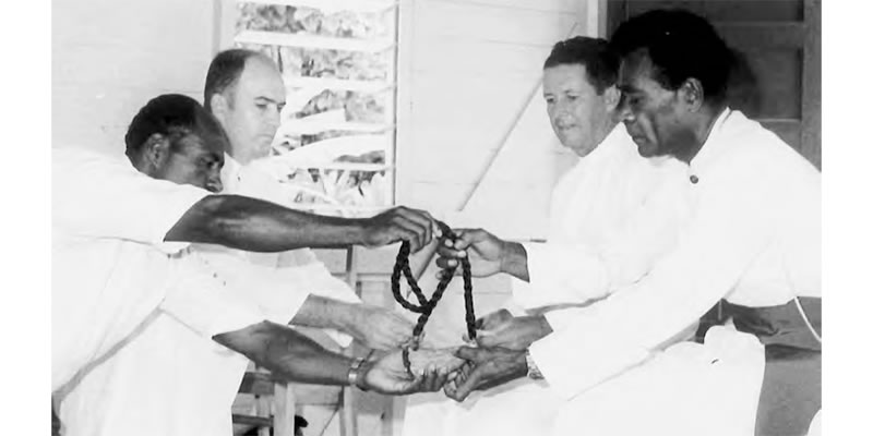 Receiving the whale tooth, the highest Fijian honor