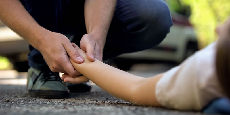 Good Samaritan helping an injured person