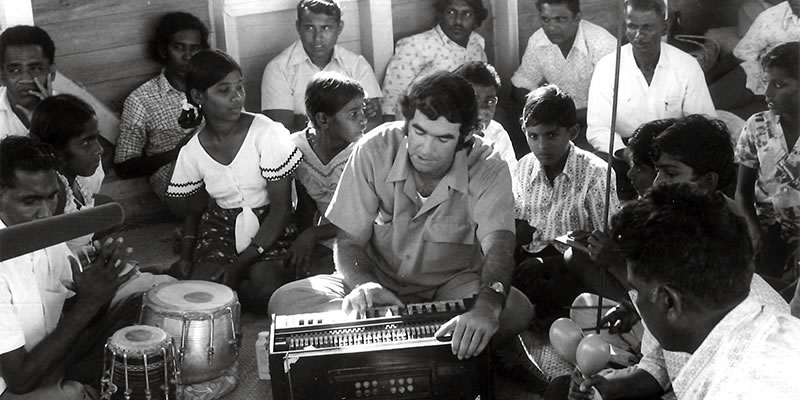 A young Fr. Frank Hoare singing with Indo-Fijian parishioners