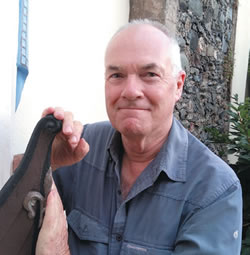 Fr. John Boles beside the &quot;oar-less coracle&quot;