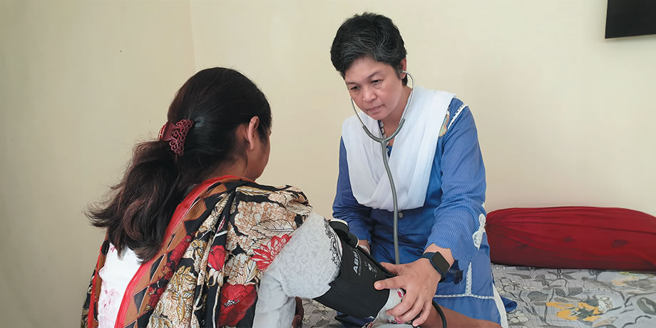 Sr. Anne on a home visitation with the sick in Pakistan.