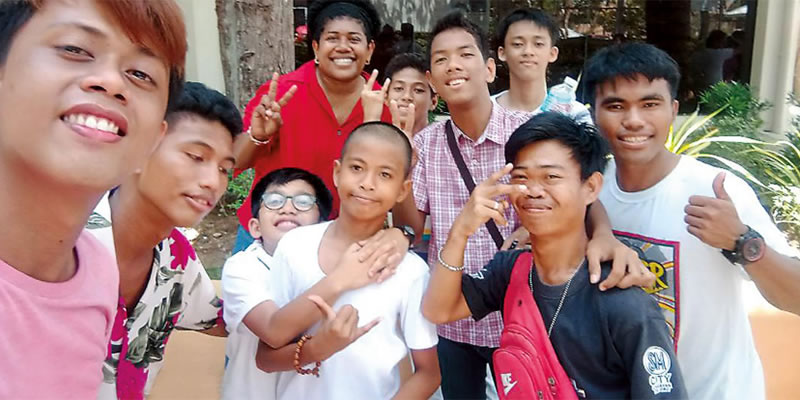 Columban Lay Missionary Lanieta Tamatawale (back row, in red) with members of the deaf community in the Philippines.