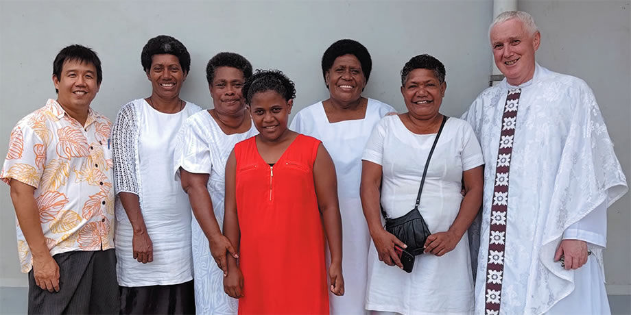 Parishioners with Fr. Carlo (left) and Fr. Tim