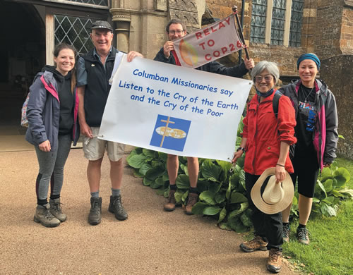 Columban team outside a church