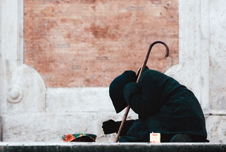 Beggar along a street