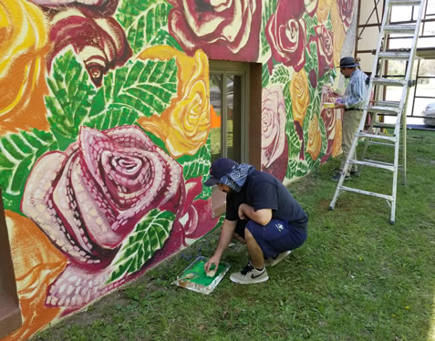 Artists paint the mural