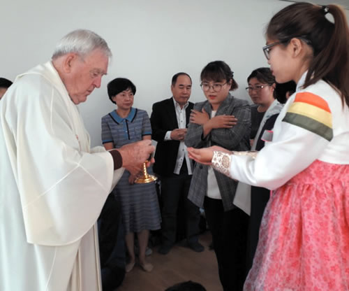 Fr. Noel and Youn at Mass