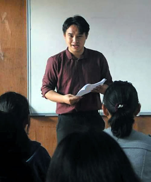 John Paul speaking before students