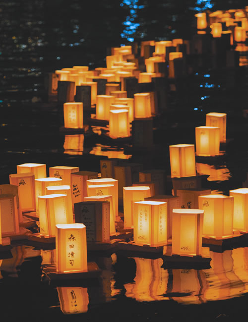 Candle lanterns on the water