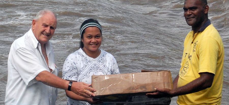 Carrying the altar cloth after the trip across the river