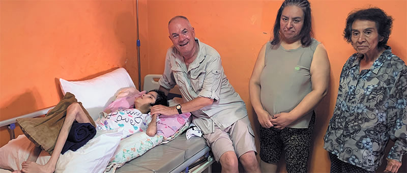 Fr. John Boles with Andrea and her family