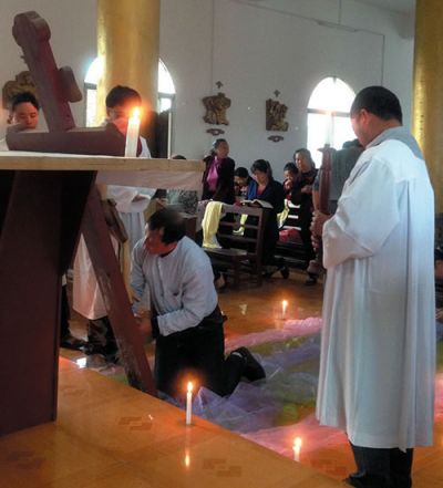 The procession returns to the church for Good Friday litergy