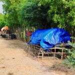 Families camping on the road in Jaat Sim village.