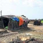 Destroyed roof patched with blankets