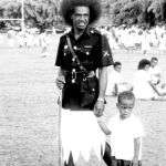 Fijian policeman with a young boy