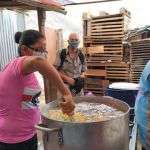 Fr. John watching the women preparing food