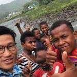 Seminarian Kyaw Zaw (wearing glasses) with village youth