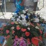 A grandson of Sonny Boy being comforted beside the casket by his uncle