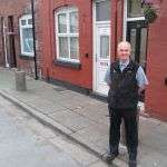 Fr. John Boles outside George Harrison's childhood door