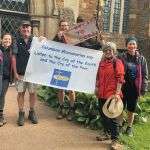 Group of Columbans with banner