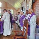 Guests attend Mass