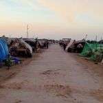 Flood victims camping on the roadside in Pithoro