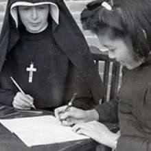 Columban Sister and girl studying 