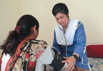 Sr. Anne on a home visitation with the sick in Pakistan.