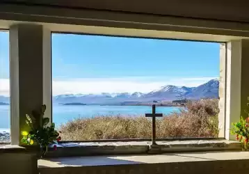 Windows overlooking a bay.