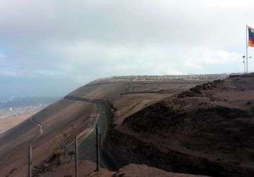 The Inca flag flies at the entrance of Alto Hospicio