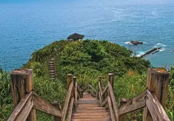 Stairs walking down a hill to the water